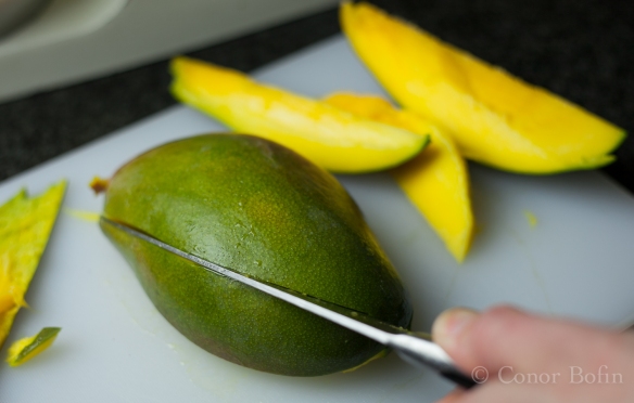 One of the benefits of cutting mango is the tasty bits that never make it to the cake. 