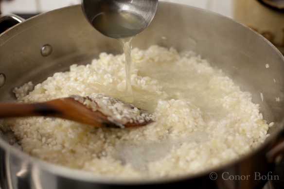 The risotto will slowly start to bulk up as this process goes on.